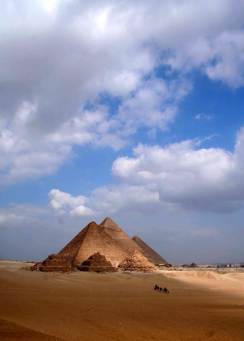 Egyptian pyramids with camel caravan