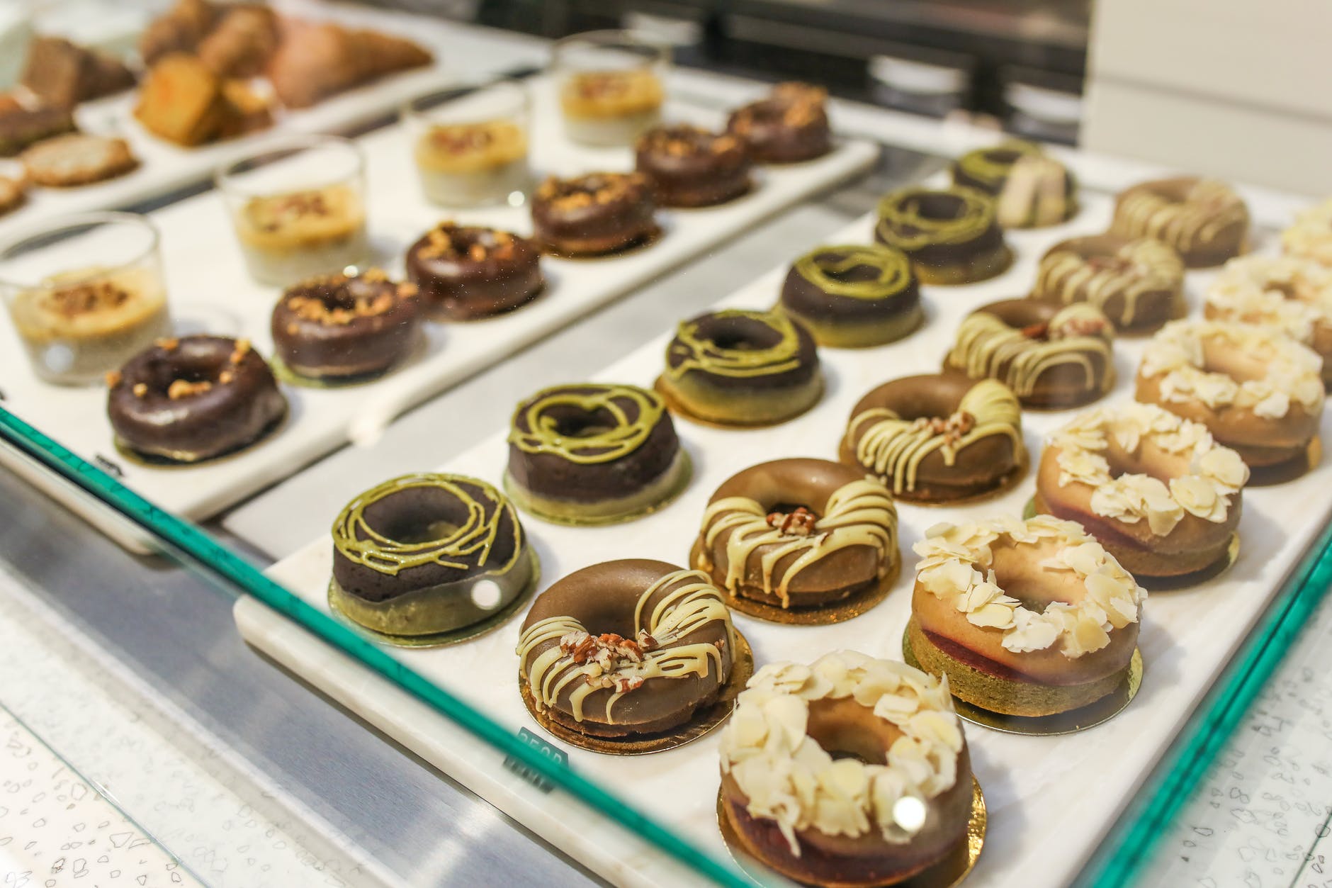 variety of donuts on tray on counter