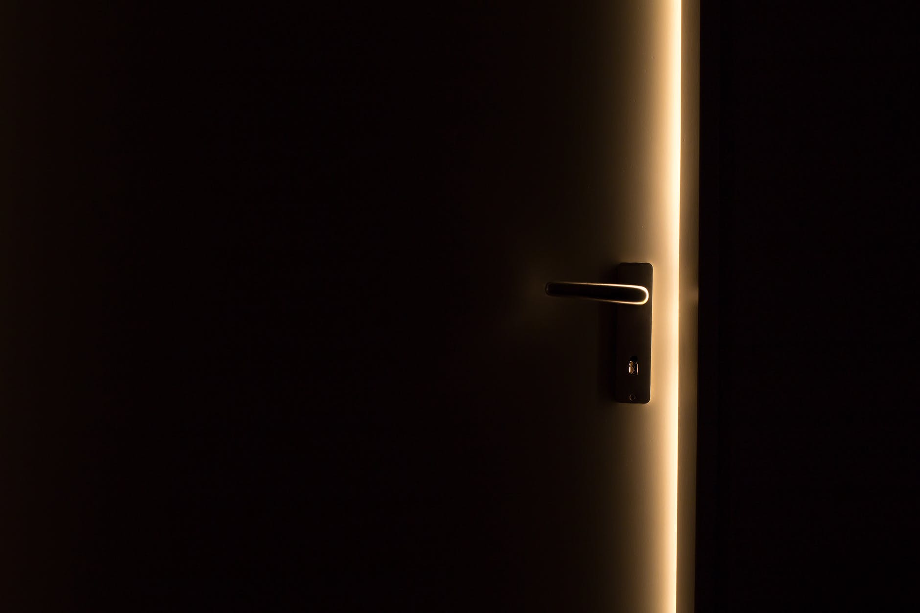 door slightly ajar in the dark